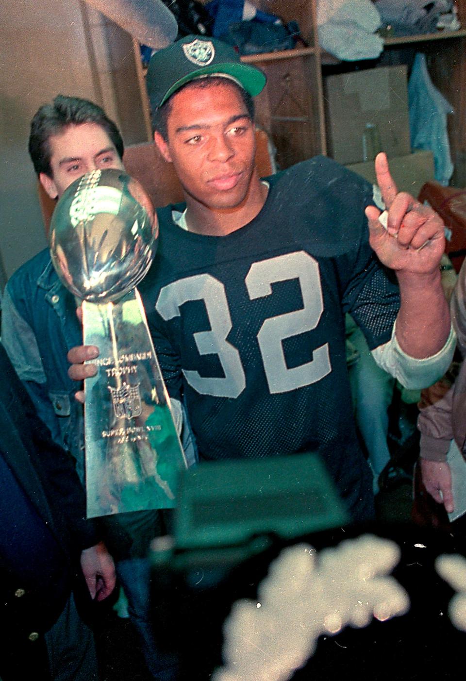 Raiders running back Marcus Allen, holding the Vince Lombardi Trophy after winning Super Bowl XVIII, was hoping the Detroit Lions made this year's game.
