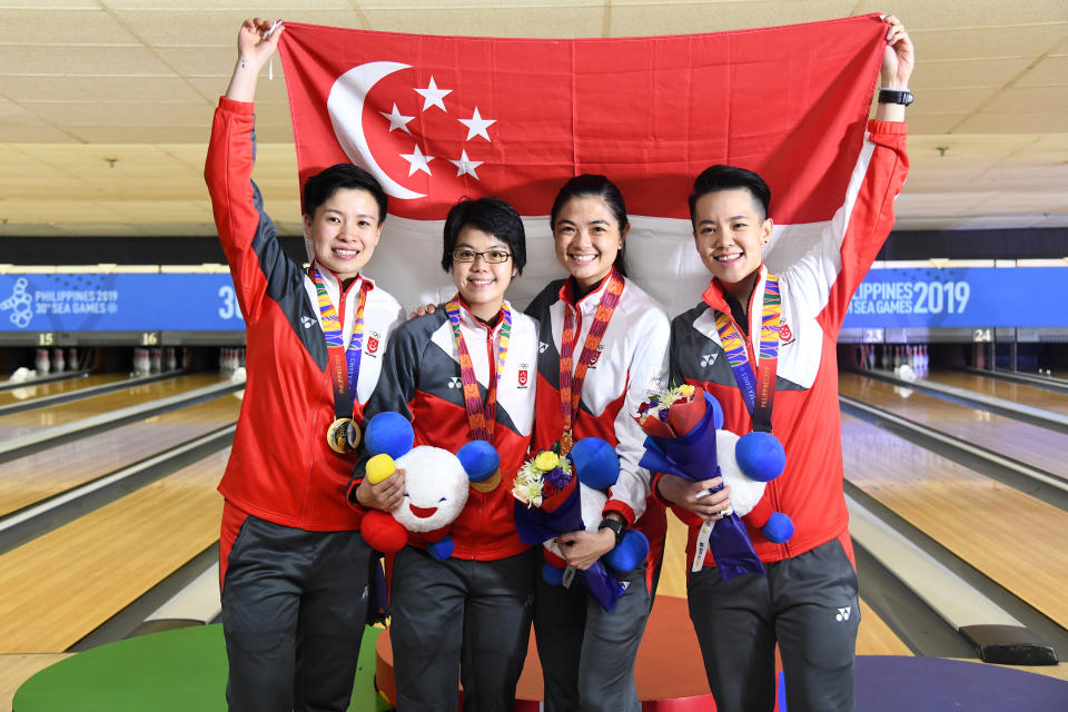 Singapore's women's bowling team – comprising (from left) New Hui Fen, Cherie Tan, Daphne Tan and Shayna Ng – clinched their first team gold since the 2011 SEA Games. (PHOTO: SNOC/Lim Weixiang)