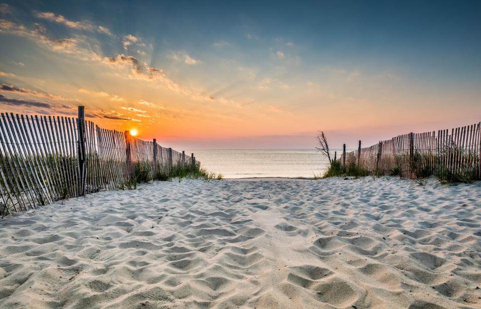 <p>You can almost feel the sensation of sand between your toes looking at this beach in Delaware leading to the Atlantic Ocean. </p>