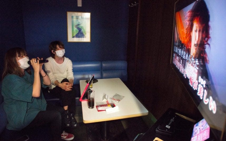 Singers join the crooning at a karaoke box in Yokohama - ROB GILHOOLY