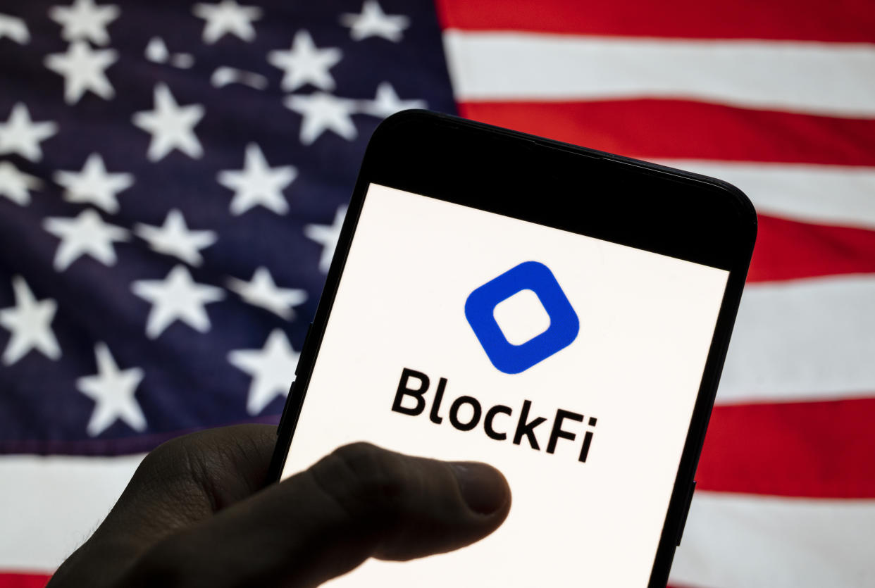 CHINA - 2021/04/02: In this photo illustration the cryptocurrency exchange trading platform Blockfi logo is seen on an Android mobile device with United States of America (USA), commonly known as the United States (U.S. or US), flag in the background. (Photo Illustration by Budrul Chukrut/SOPA Images/LightRocket via Getty Images)