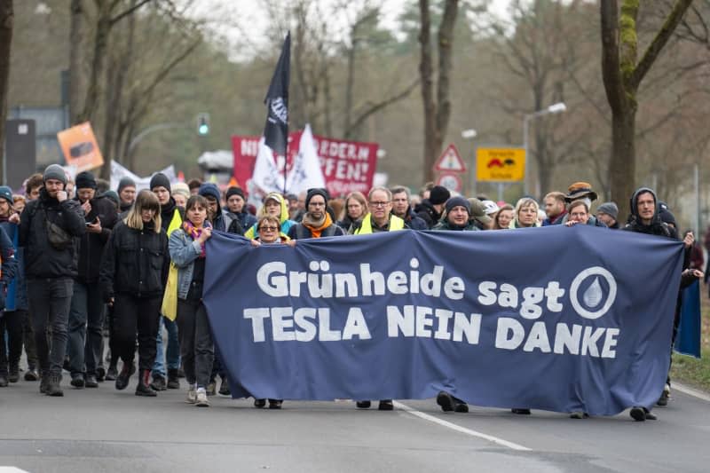 People take part in the final rally of a demonstration under the motto 