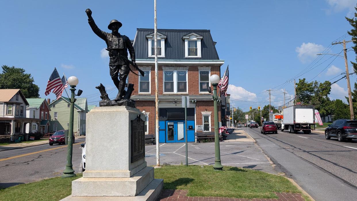 Blendz Barber Shop in Chambersburg behind a World War Memorial.