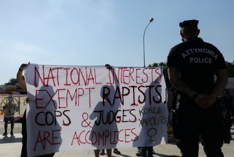 Activists take part in a demonstration supporting a British woman who says she was pressured into retracting a claim of gang rape, outside the Supreme court in Nicosia