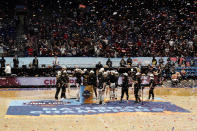 FILE - Stanford players celebrate on the court after the championship game against Arizona in the women's Final Four NCAA college basketball tournament in San Antonio, in this Sunday, April 4, 2021, file photo. A law firm hired to investigate gender equity concerns at NCAA championship events released a blistering report Tuesday, Aug. 3, 2021, that recommended holding the men's and women's Final Fours at the same site and offering financial incentives to schools to improve their women's basketball programs. (AP Photo/Morry Gash, File)