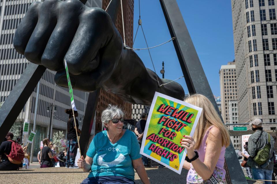 MaryJane Faso of Royal Oak talks with a friend during a protest to protect abortion rights and the continuation of abortion medication at Hart Plaza in Detroit on Saturday, April 15, 2023. 