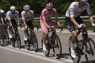 Slovenia's Tadei Pogacar, in the pink jersey at center, pedals during the 9th stage of the of the Giro d'Italia cycling race, from Avezzano to Naples, Italy, Sunday, May 12, 2024. (Fabio Ferrari/LaPresse via AP)