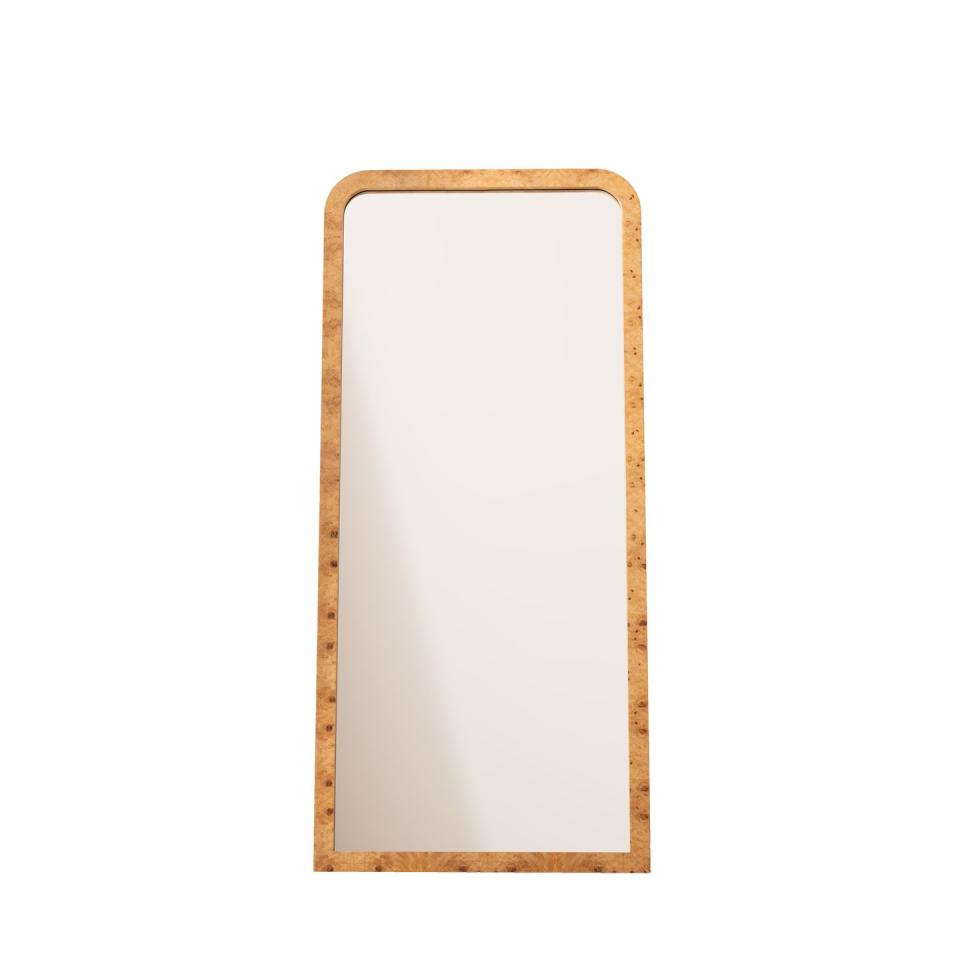 a mirror with a burr wood border