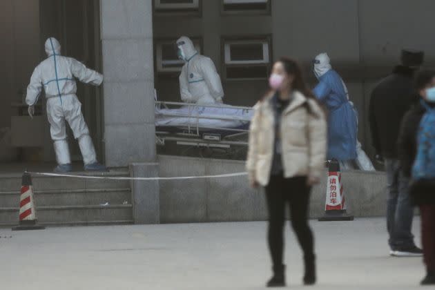 Medical staff transfer a patient at the Jinyintan hospital, where the patients with pneumonia caused by the new strain of coronavirus are being treated, in Wuhan, Hubei province, China January 20, 2020. REUTERS/Stringer CHINA OUT.     TPX IMAGES OF THE DAY