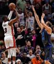 Mar 28, 2019; Miami, FL, USA; Miami Heat guard Dwyane Wade (3) shoots the ball over Dallas Mavericks forward Dirk Nowitzki (41) during the second half at American Airlines Arena. Mandatory Credit: Jasen Vinlove-USA TODAY Sports