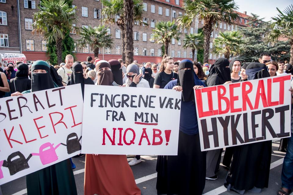 Women wearing niqabs to veil their faces take part in a demonstration on August 1, 2018, the first day of the implementation of the Danish face veil ban, in Copenhagen, Denmark.