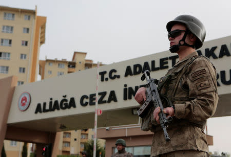 A Turkish gendarme stands guard at the entrance of Aliaga Prison and Courthouse complex in Izmir, Turkey April 16, 2018. REUTERS/Sadi Osman Temizel