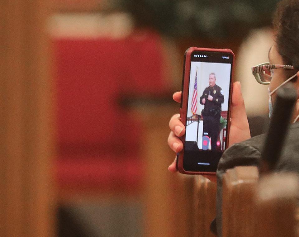 Someone in the audience videotapes Akron Police Chief Steve Mylett last week during a community conversation about grand juries, use of force and peaceful protesting in the run up to a grand jury deciding this month whether any of the eight Akron police officers who shot and killed Jayland Walker last year should face criminal charges.