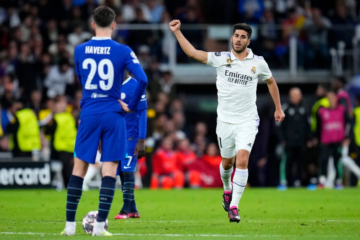Marco Asensio celebrates scoring Madrid’s second goal as Kai Havertz looks on (AP)