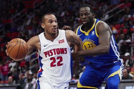 Dec 8, 2017; Detroit, MI, USA; Detroit Pistons guard Avery Bradley (22) dribbles defended by Golden State Warriors forward Draymond Green (23) in the second half at Little Caesars Arena. Rick Osentoski-USA TODAY Sports