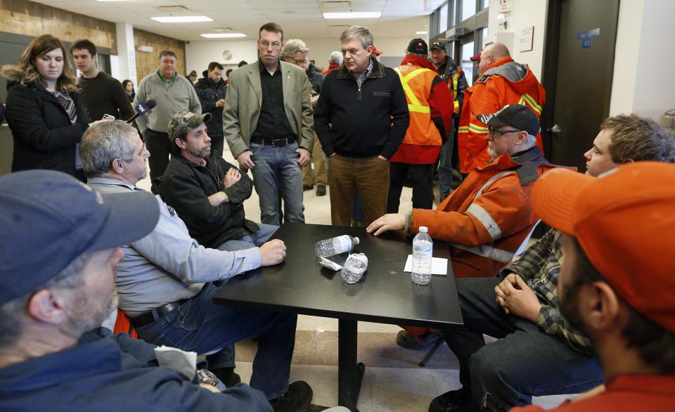 New Brunswick Premier David Alward speaks to emergency workers at Tobique-Plex arena in Plaster Rock