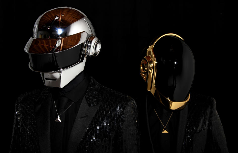 In this April 17, 2013 photo, Thomas Bangalter, left, and Guy-Manuel de Homem-Christo, from the music group, Daft Punk, pose for a portrait in Los Angeles. The electronic duo's new studio album, "Random Access Memories" releases in the US on May 21. (Photo by Matt Sayles/Invision/AP)