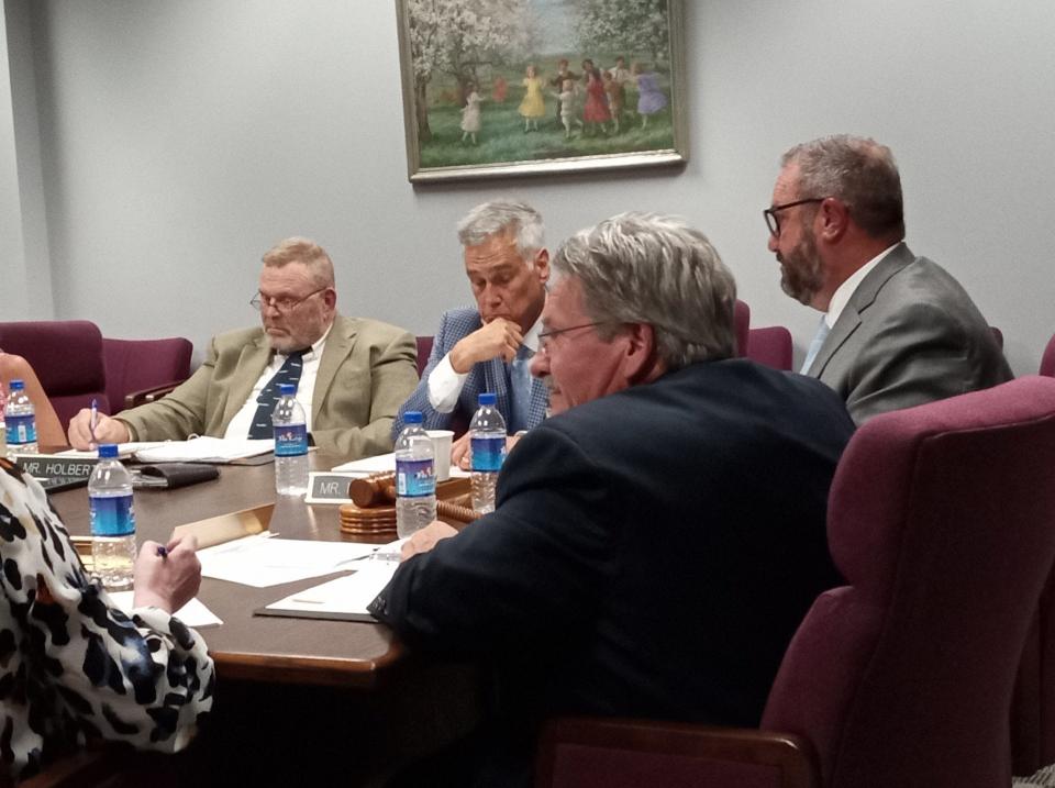 Pictured at the Wayne Highlands School Board meeting, June 20, counterclockwise are George Korb, Vice-President; Assistant Superintendent Timothy Morgan and board members Thomas Fasshauer and Lothar Holbert. Most of the other board members and administrators were also present.