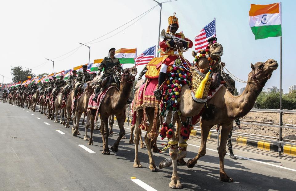 Mounted soldiers ride camels outside the Sardar Patel Gujarat Stadium in Ahmedabad, where Trump and Modi will hold a rally on Monday: EPA