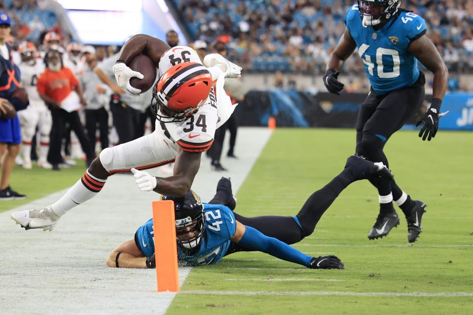 Cleveland Browns running back Jerome Ford (34) is shoved out of bounds by Jacksonville Jaguars safety Andrew Wingard (42) at the 2-yard line during the second quarter of a preseason NFL game Friday, Aug. 12, 2022 at TIAA Bank Field in Jacksonville. [Corey Perrine/Florida Times-Union]