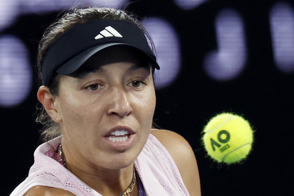 Jessica Pegula of the U.S. plays a backhand return to Aliaksandra Sasnovich of Belarus during their second round match at the Australian Open tennis championship in Melbourne, Australia, Wednesday, Jan. 18, 2023. (AP Photo/Asanka Brendon Ratnayake)