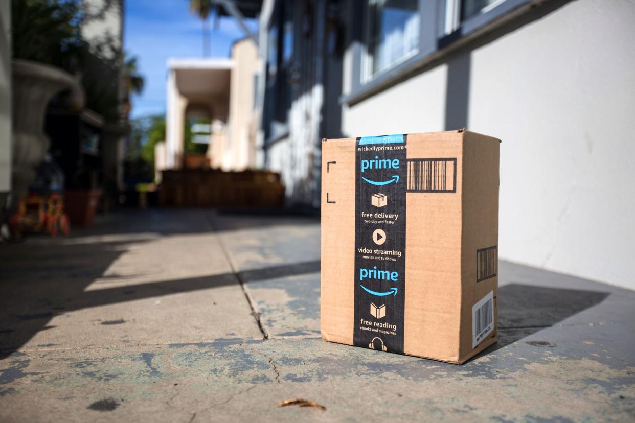 amazon prime box sitting on sidewalk