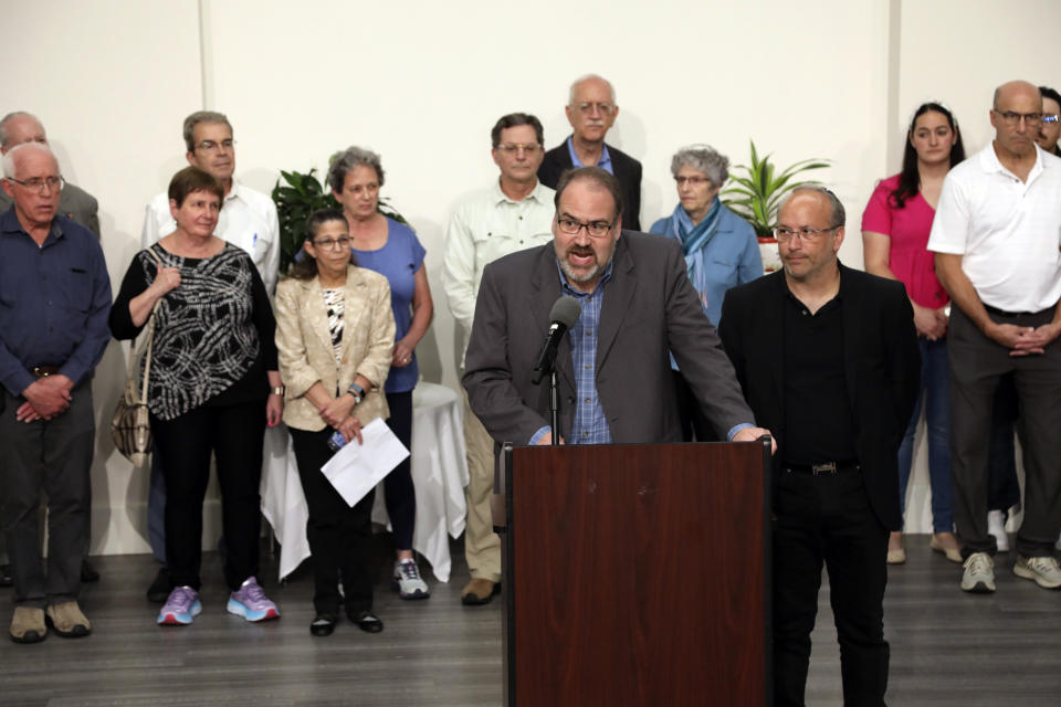 Howard Fienberg speaks to the media surrounded by victims and families of victims following the sentencing of Robert Bowers at the Jewish Community Center in Pittsburgh, Wednesday, Aug 2, 2023. Bowers was sentenced to death for killing 11 people at the Tree of Life synagogue in Pittsburgh in 2018. (AP Photo/Rebecca Droke)