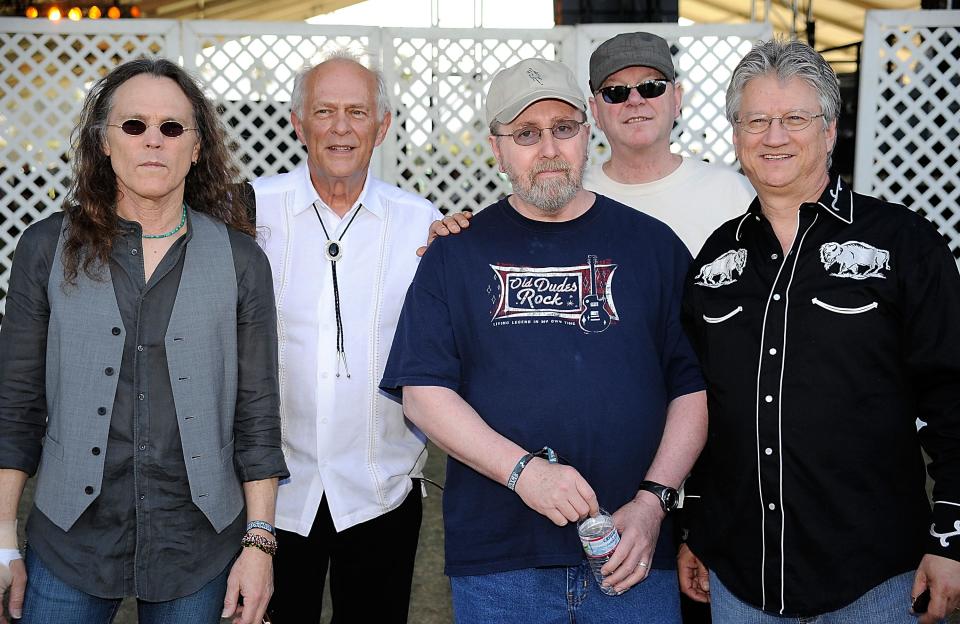 (L-R) Timothy B. Schmit, Paul Cotton, George Grantham, Rusty Young and Richie Furay pose backstage during day two of California's Stagecoach Country Music Festival held at the Empire Polo Club on April 26, 2009 in Indio, California.