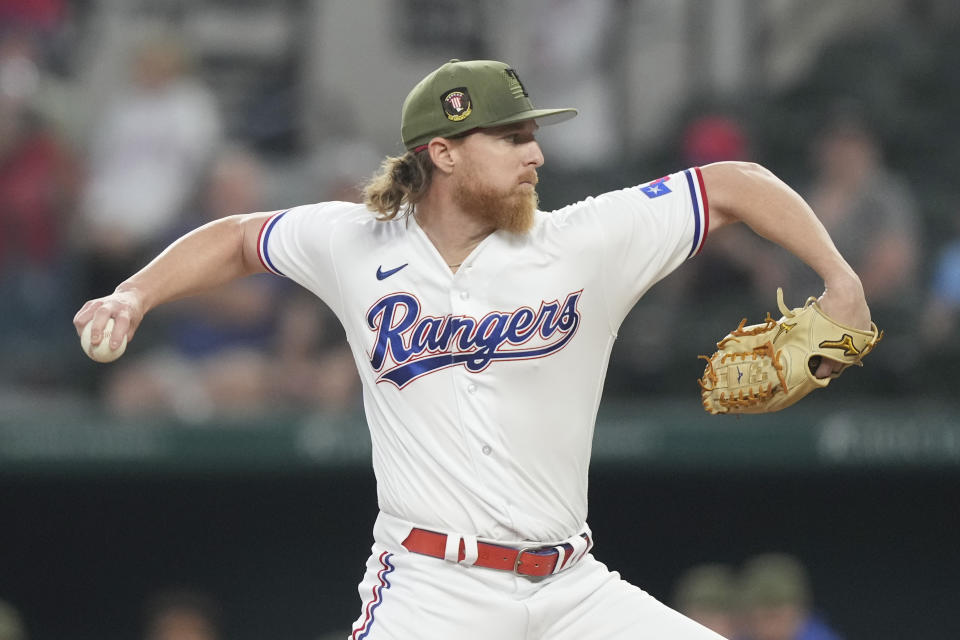 Texas Rangers starting pitcher Jon Gray throws during the first inning of a baseball game against the Colorado Rockies in Arlington, Texas, Saturday, May 20, 2023. (AP Photo/LM Otero)