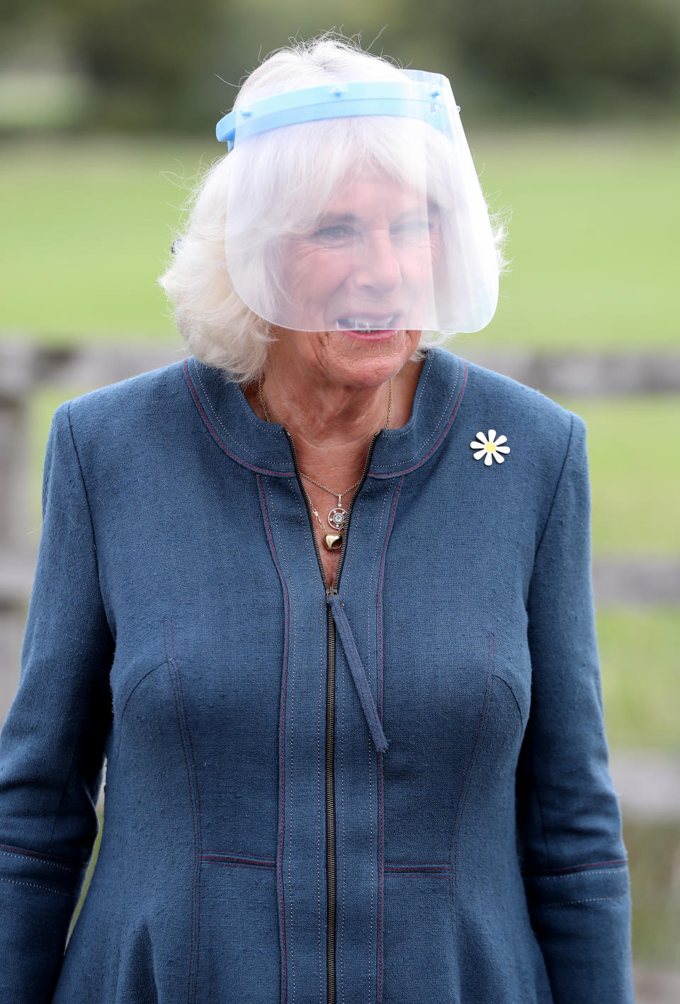 MILTON KEYNES, ENGLAND - SEPTEMBER 09:  Camilla, Duchess of Cornwall, Patron of Medical Detection Dogs, wears a visor during a visit to the charity’s training centre where trials are currently underway to determine whether dogs can act as a diagnostic tool of COVID-19 on September 09, 2020 in Milton Keynes, England. (Photo by Chris Jackson - WPA Pool/Getty Images)