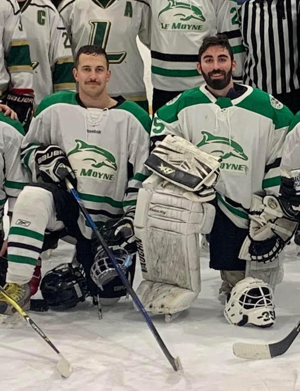 This 2023 photo shows fallen Syracuse Police Officer Michael Jensen, left, at an alumni hockey game at Le Moyne College.