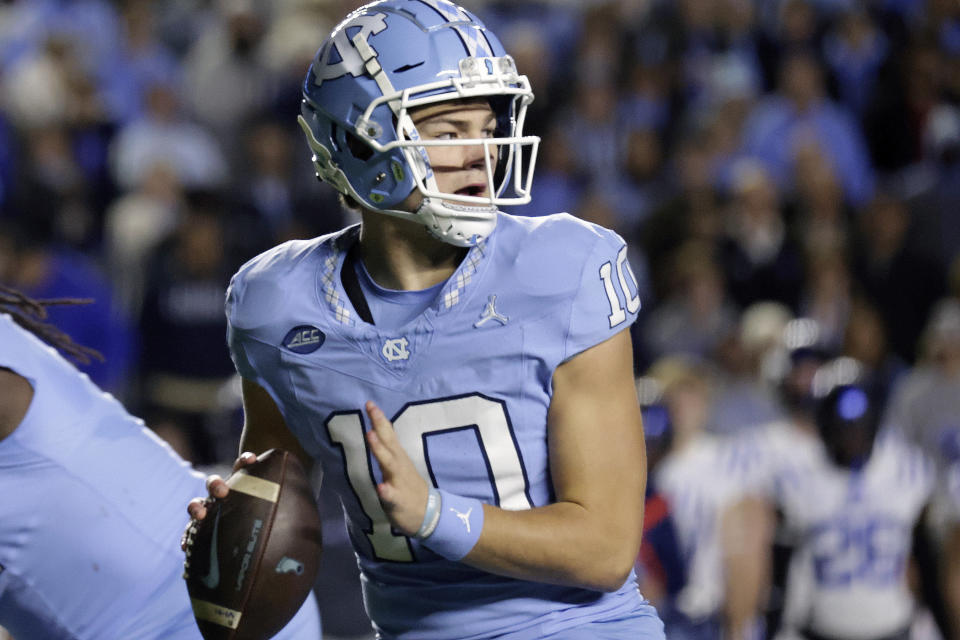 North Carolina quarterback Drake Maye looks for a receiver during the first half of the team's NCAA college football game against Duke on Saturday, Nov. 11, 2023, in Chapel Hill, N.C. (AP Photo/Chris Seward)