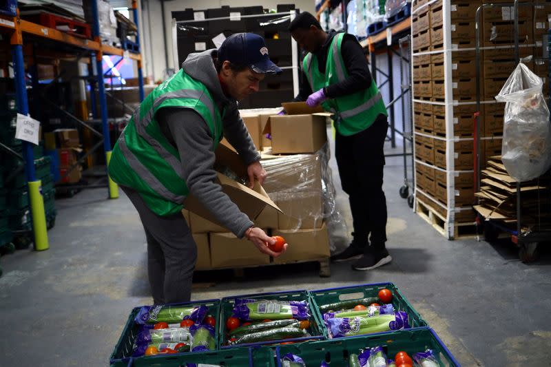 Volunteers sort food and check quality at the FareShare food redistribution centre in Deptford, as the spread of the coronavirus disease (COVID-19) continues, in south east London