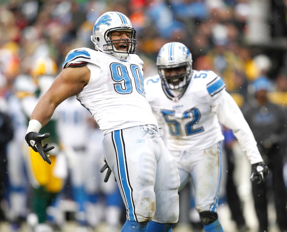 Ndamukong Suh celebrates a sack of Matt Flynn on Jan. 1, 2012, with a "belt" celebration. Flynn set records for passing yards and touchdowns in a game and Green Bay beat the Lions, 45-41. January 1, 2012.