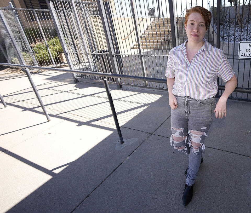 Jenn Cahlifoux poses at Jeffco Stadium in the west Denver suburb of Lakewood, Colo., on Friday, April 22, 2022. Chalifoux, 30 and studying law at the University of Colorado in Boulder, became pregnant in 2010, when she was 18 years old and receiving inpatient care for an eating disorder in New York. (AP Photo/David Zalubowski)