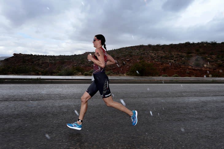 <span class="article__caption">Heather Wurtele runs in a hail storm en route to the women’s victory during the 2016 Ironman 70.3 North American Pro Championship in St. George, Utah.</span> (Photo: Donald Miralle/Getty Images)