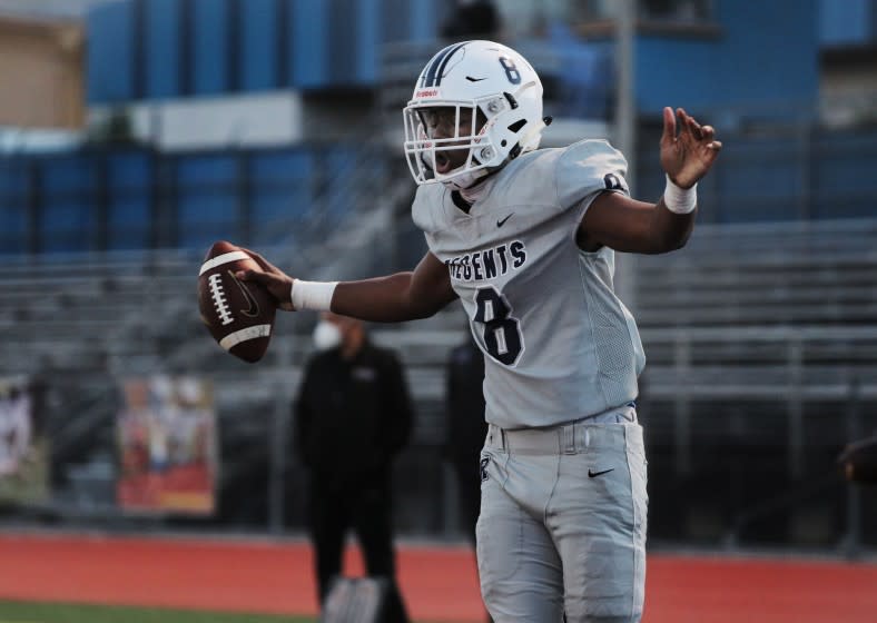 LOS ANGELES, CA - APRIL 9, 2021: Reseda wide receiver Ayo Olabade (8) reacts after catching a pass in the end zone for 2 - point conversion against Crenshaw to give Reseda the lead in the first half at Crenshaw High School on April 9, 2021 in Los Angeles, California.(Gina Ferazzi / Los Angeles Times)