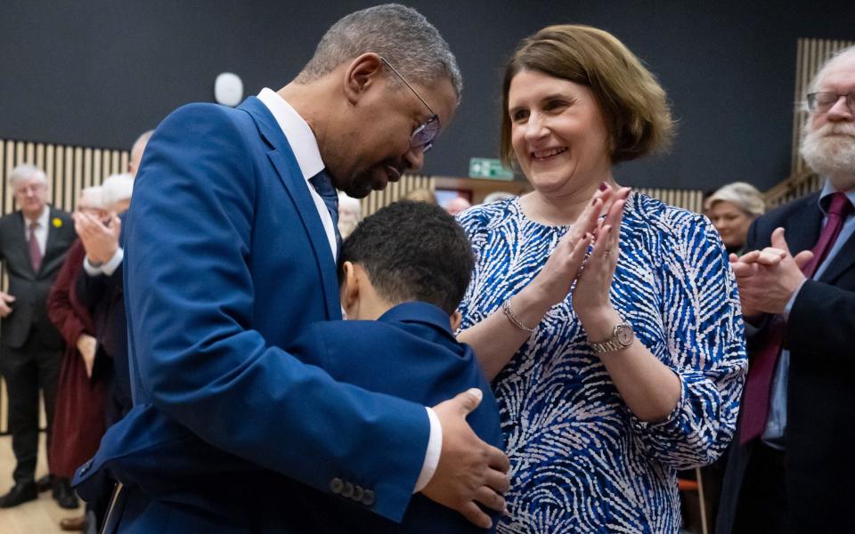 Vaughan Gething celebrates with his wife Michelle and son Isaac as he is announced as the fifth First Minister of Wales on Saturday