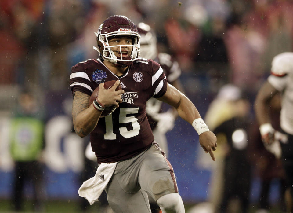 Mississippi State quarterback Dak Prescott (15) scrambles against North Carolina State in the first half of the Belk Bowl NCAA college football game in Charlotte, N.C., Wednesday, Dec. 30, 2015. (AP Photo/Nell Redmond)