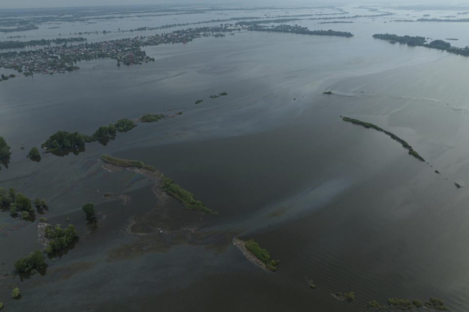 Pollution by oil is seen in Dnipro river in the flooded Kherson, Ukraine, Saturday, June 10, 2023. The destruction of the Kakhovka Dam in southern Ukraine is swiftly evolving into long-term environmental catastrophe. It affects drinking water, food supplies and ecosystems reaching into the Black Sea. (AP Photo)