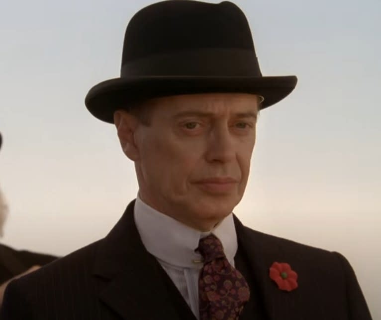 Steve Buscemi as Nucky Thompson looking onto a crowd of people