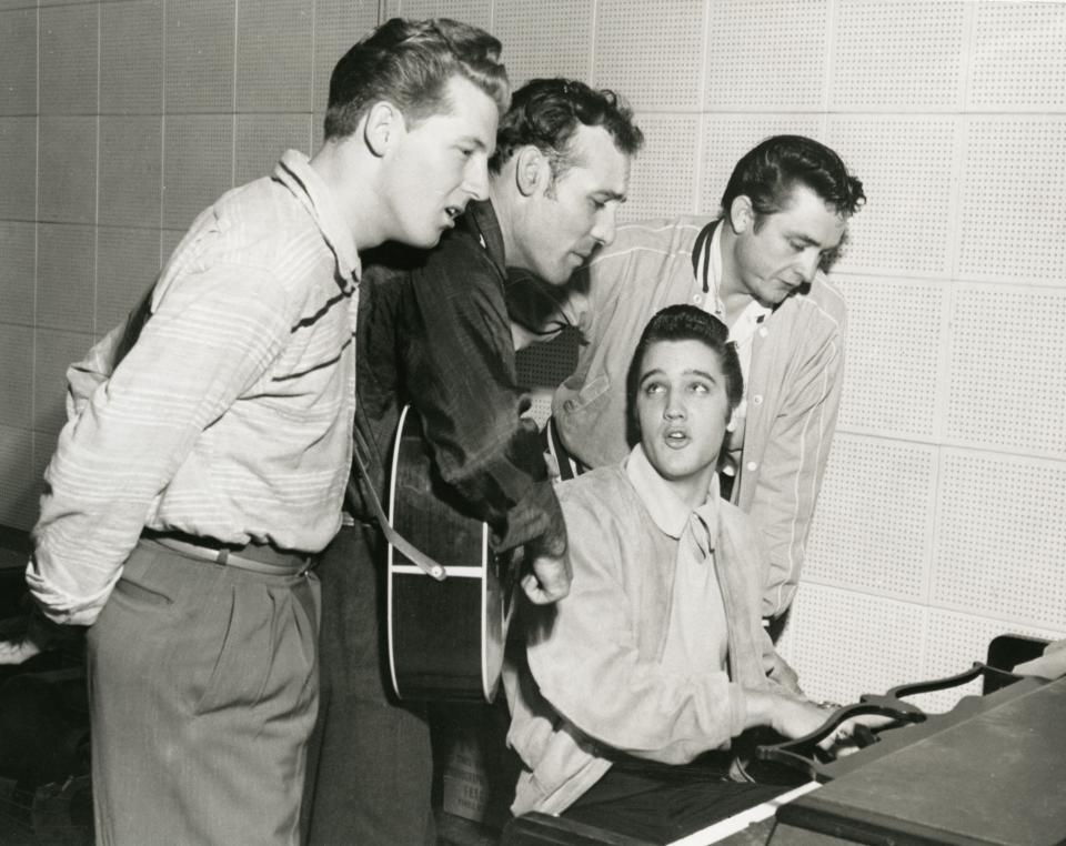 An archival photo of Jerry Lee Lewis, Carl Perkins, Elvis Presley, and Johnny Cash at the Sun Records studio in Memphis, 1956 used in Ken Burns' PBS documentary, "Country Music."