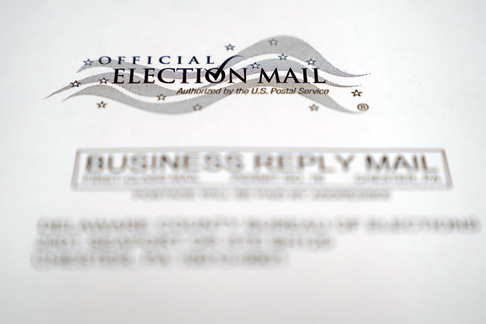 In this Oct. 13, 2020, photo, an envelope of a Pennsylvania official mail-in ballot for the 2020 general election in Marple Township, Pa. The Supreme Court will allow Pennsylvania to count ballots received up to three days after the election, rejecting a Republican plea. The justices divided 4-4 on Oct. 19, an outcome that upholds a state Supreme Court ruling that allowed election officials to receive and count ballots until Nov. 6, even if they don't have a clear postmark. (AP Photo/Matt Slocum)