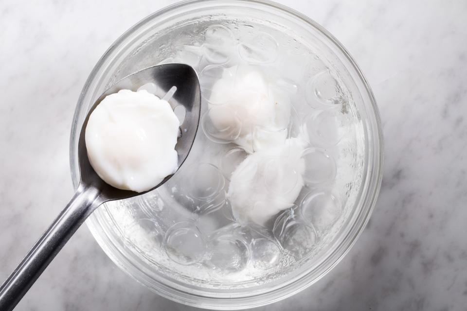 Cooking brunch for a big group? Want poached eggs every morning? Here's a secret: You can cook them ahead of time. After cooking, immediately put the eggs into a bowl of ice water. (This stops the cooking process, ensuring your yolks will be that ideal runny texture.) Eggs can be held in a resealable container filled with cold water in the refrigerator for up to 3 days. To serve, place the eggs in a bowl of hot water (hot tap water works fine here) until the whole egg feels warm to the touch, about 2 minutes.