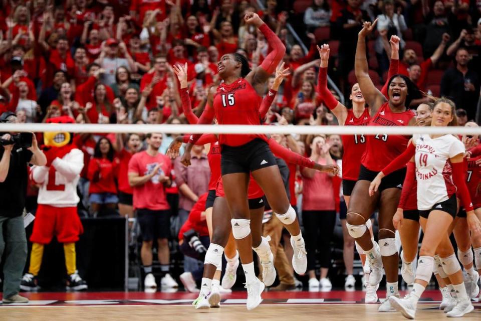 Louisville’s Aiko Jones (15) celebrates the Cardinals’ sweep of Kentucky on Wednesday night, which was U of L’s third straight win over the Wildcats.