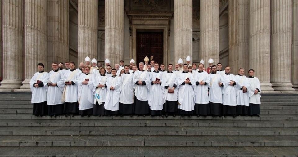 A class of priests on the steps of St Paul's Cathedral.