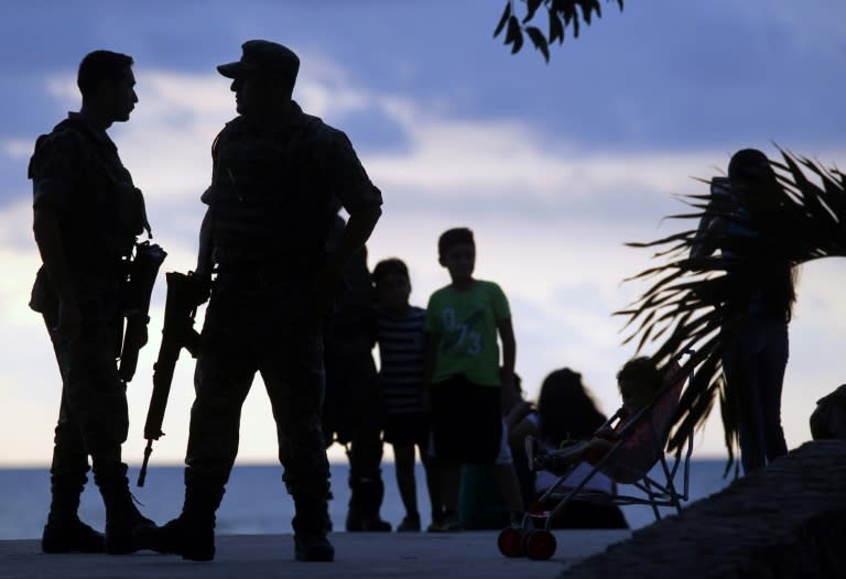 Mexican soldiers patrol the dock in Puerto Vallarta, in Mexico's Jalisco State, ahead of a summit of the Pacific Alliance