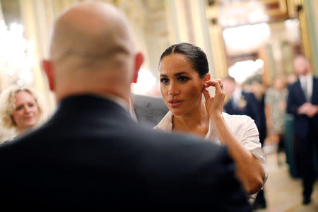 Meghan, Duchess of Sussex, meets guests during a pre-ceremony reception before the Endeavour Fund Awards in the Drapers' Hall in London, Britain February 7, 2019. Tolga Akmen/Pool via REUTERS