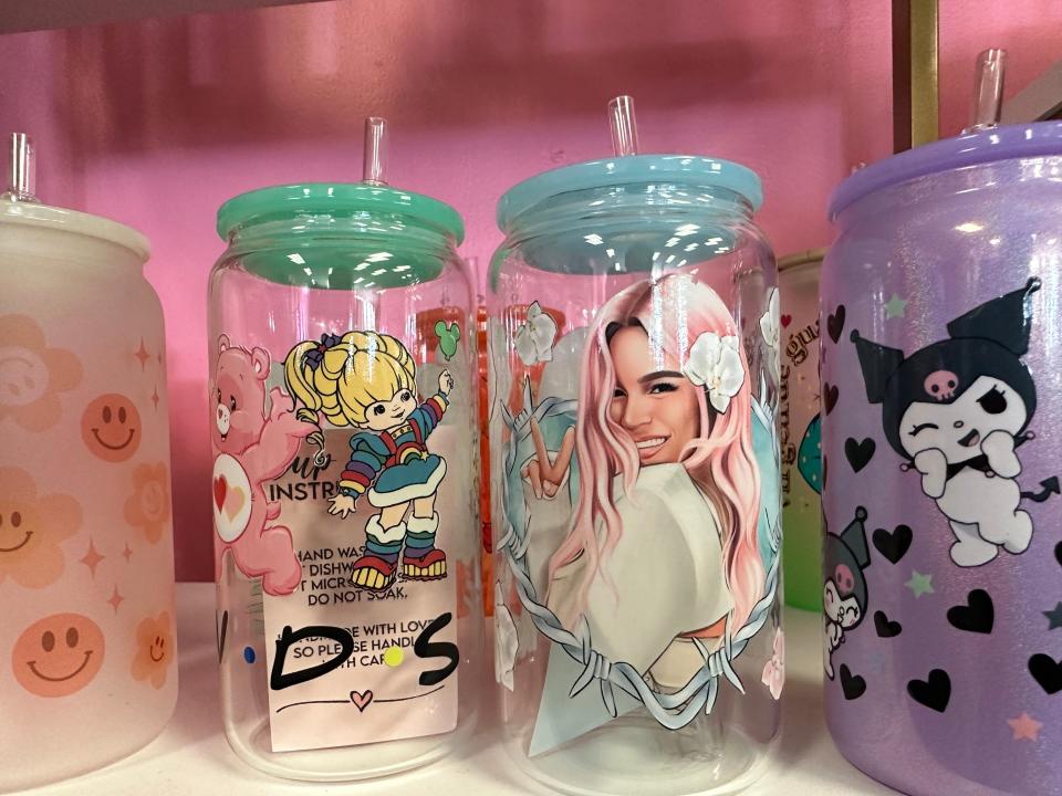 From Care Bears to Karol G, there are plenty of cups to choose from with various designs at Hidden Gem. (Photo taken Friday, Dec. 1, 2023.)