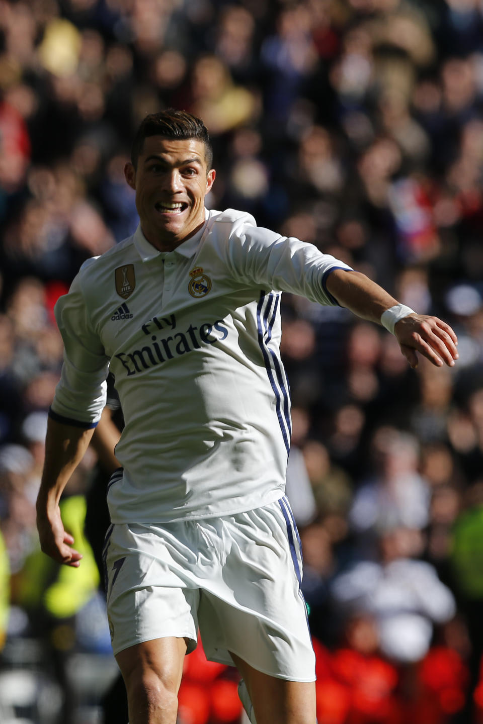 Real Madrid's Cristiano Ronaldo celebrates after scoring his team's third goal against Granada during the Spanish La Liga soccer match between Real Madrid and Granada at the Santiago Bernabeu stadium in Madrid, Saturday, Jan. 7, 2017. Ronaldo scored once in Real Madrid's 5-0 victory. (AP Photo/Francisco Seco)